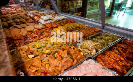 Variety of marinated meat at display counter Stock Photo