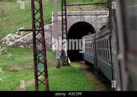 Transportation railway train enters the tunnel, the view from the car of a train Stock Photo