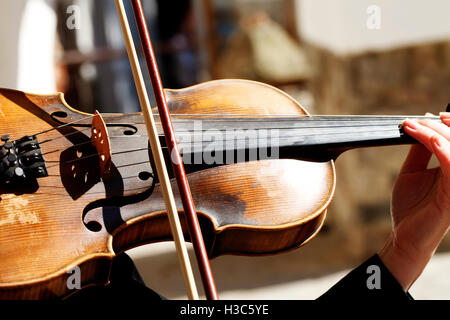 violinist playing the instrument, close-up, background music Stock Photo