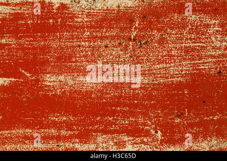 a grunge metal texture with cracked red paint Stock Photo