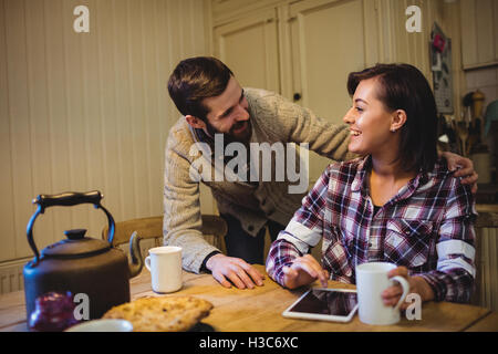 Couple interacting with each other while having coffee Stock Photo