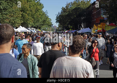 Large crowd of people attend the annual Atlantic Antic street fair held on the last Sunday of September in Brooklyn New York. At Stock Photo