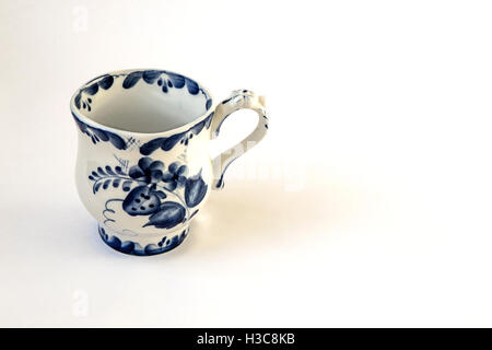 A decorative small empty milk jug isolated on white. Stock Photo