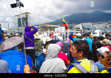 QUITO, ECUADOR - JULY 7, 2015: A sunny day with lots of people waitting for pope Francisco, Ecuador flags between everyone Stock Photo