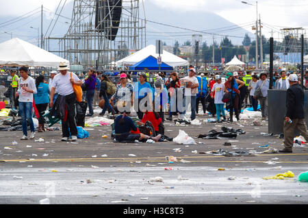 QUITO, ECUADOR - JULY 7, 2015: After pope Francisco mass event, people trying to get out. Rainning is comming, tends on the street Stock Photo