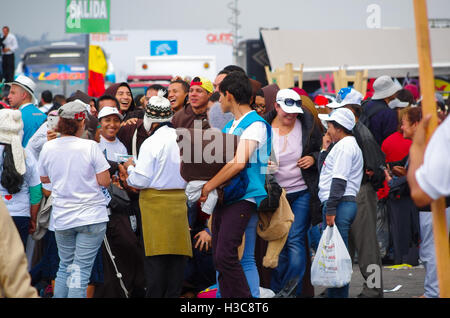 QUITO, ECUADOR - JULY 7, 2015: Priest group in pope Francisco mass event singing with people, men holding a bag Stock Photo