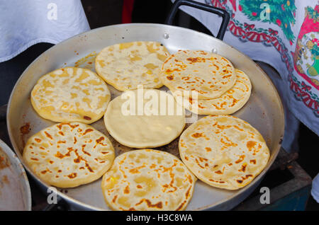 QUITO, ECUADOR - JULY 7, 2015: Fried tortillas on sale in the street, steel pot Stock Photo