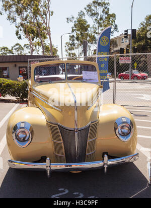 Laguna Beach, CA, USA - October 2, 2016: Yellow 1940 Ford Deluxe Convertible owned by Larry Davis and displayed at the Rotary Cl Stock Photo