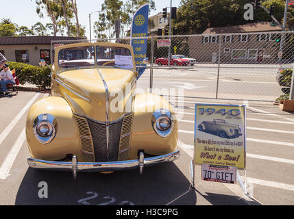 Laguna Beach, CA, USA - October 2, 2016: Yellow 1940 Ford Deluxe Convertible owned by Larry Davis and displayed at the Rotary Cl Stock Photo