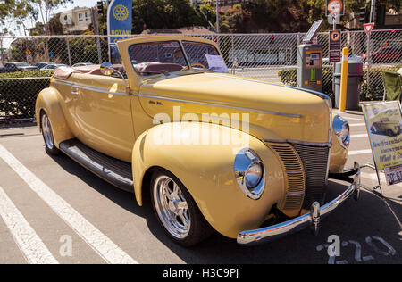 Laguna Beach, CA, USA - October 2, 2016: Yellow 1940 Ford Deluxe Convertible owned by Larry Davis and displayed at the Rotary Cl Stock Photo