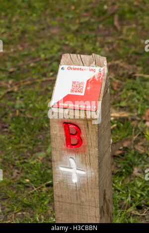 Orienteering control point with QR (Quick response) code label at Moses Gate Country Park, Bolton. Stock Photo