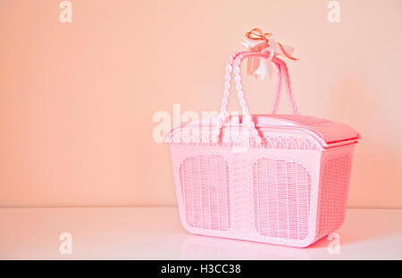 Pink basket with copy space on background Stock Photo