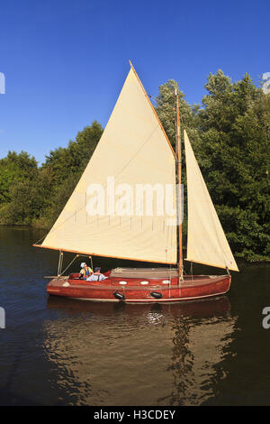 Hustler Class Wooden Sloop near Wroxham on the Norfolk Broads, Norfolk, England, UK Stock Photo