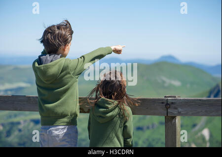 Children looking at mountain view Stock Photo