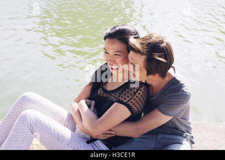 Couple relaxing together outdoors Stock Photo