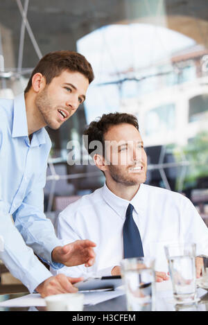 Businessmen collaborating Stock Photo