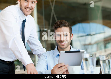 Business partners working together on digital tablet Stock Photo