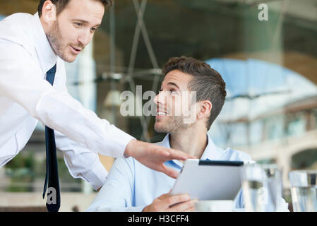 Businessmen collaborating project using digital tablet Stock Photo
