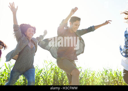 Young people leaping with exuberance Stock Photo