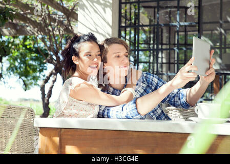 Young couple taking selfie with digital tablet Stock Photo