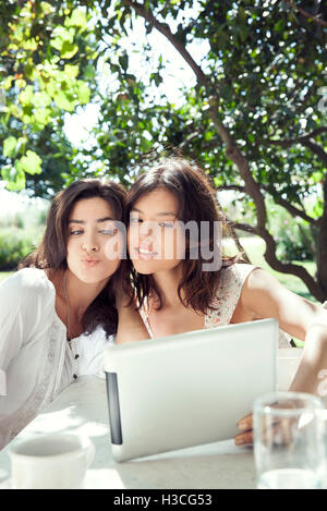 Young women taking selfie with digital tablet Stock Photo