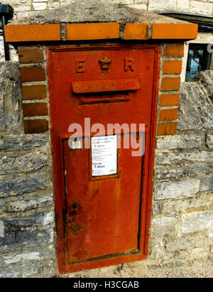 Wall mounted Edward VII red post box in Swanage, Dorset UK Stock Photo