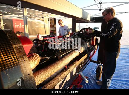 Mechanics prepare the 1,000 bhp Triumph Infor Rocket Streamliner before it is ridden by Guy Martin across the salt flats in Utah, as Triumph Motorcycles attempt to break the motorcycle world land speed record at the Bonneville Speedway in Utah, USA. Stock Photo