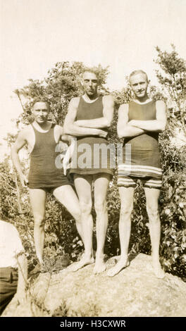 Antique c1925 photograph, three men in 1920s style swim suits. SOURCE: ORIGINAL PHOTOGRAPHIC PRINT. Stock Photo