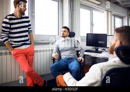 businessmen discussing in creative office Stock Photo