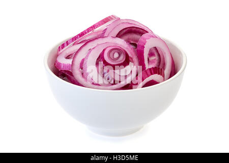 Sliced red onion in bowl on white. Stock Photo
