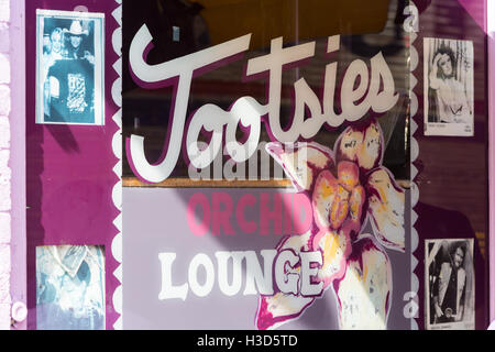 A colorful window with photographs at the front of Tootsie's Orchid Lounge on lower Broadway in Nashville, Tennessee. Stock Photo