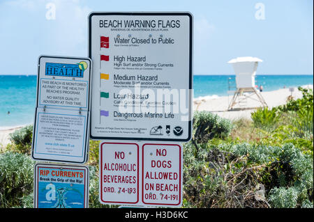 Beach warning, health and ordinance signs at the public beach in Palm Beach, Florida. (USA) Stock Photo