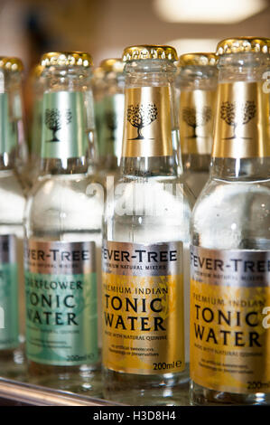 A row of tonic water bottles on a shelf in a grocery store Stock Photo ...