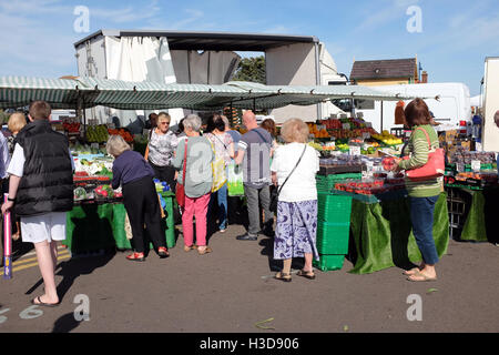 Sheringham, Norfolk, UK. September 24, 2016. A busy Greengrocer stall on the Saturday open market at Sheringham in Norfolk. Stock Photo