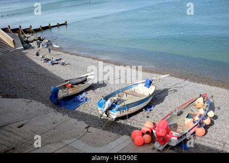 Sheringham, Norfolk, UK. September 24, 2016.  Fishing boats and holidaymakers on the beach in September at Sheringham in Norfolk Stock Photo