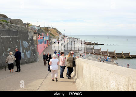 Sheringham, Norfolk, UK. September 24, 2016. Holidaymakers and tourists enjoying the promenade and beach. Stock Photo