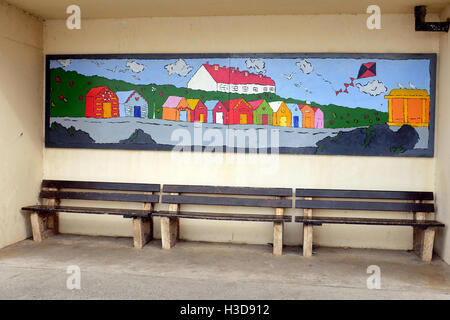 Sheringham, Norfolk, UK. September 24, 2016. board on the wall art decorates the beach shelter on the seafront at Sheringham Stock Photo