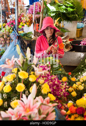 Woman selling flowers in the Central Market, Phnom Penh,Cambodia .   travel -  -  -   - Phnom Penh -  - Cambodia  - 7 F Stock Photo