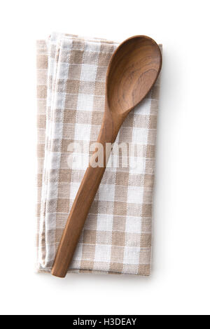 Handmade wooden spoon on checkered napkin. Top view. Stock Photo