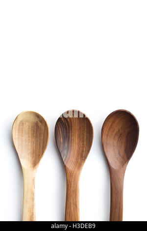 Three wooden spoons isolated on white background. Top view. Stock Photo