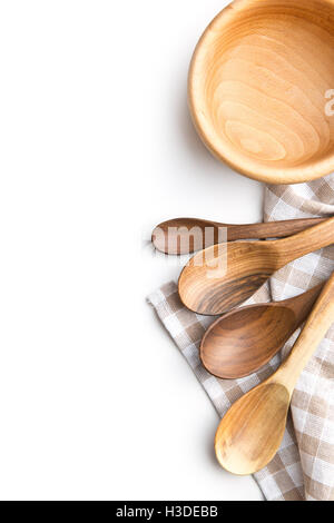 Handmade wooden spoons and wooden bowl isolated on white background. Top view. Stock Photo