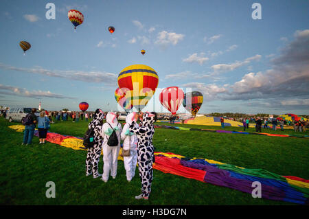 Four women wearing unique outfits at the Albuquerque International Balloon Fiesta in New Mexico, October 2016 Stock Photo