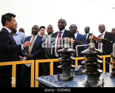 Nairobi, Kenya. 5th Oct, 2016. Charles Keter (C), Kenya's Cabinet Secretary for Energy and Petroleum, visits Yocean manufacturing transformers factory on the outskirts of Nairobi, Kenya, on Oct. 5, 2016. Kenya's first transfomer-manufacturing plant, set up by Chinese company Yocean Group, opened on Wednesday. Kenya has been relying on transformers from abroad, mostly from India. Kenya's Cabinet Secretary for Energy and Petroleum, Charles Keter, said the plant will ease procurement of transformers and other electrical appliances. © Pan Siwei/Xinhua/Alamy Live News Stock Photo