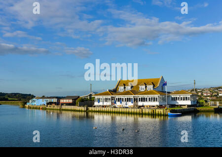 West Bay, Dorset, UK. 6th Oct, 2016. UK Weather. Glorious late afternoon autumn sunshine bathes The Riverside Restaurant which sits on the bank of the River Brit at West Bay. West Bay is one of the locations for the hit ITV series Broadchurch which returns to the screen in 2017 for a 3rd series. Picture Credit:  Graham Hunt/Alamy Live News Stock Photo