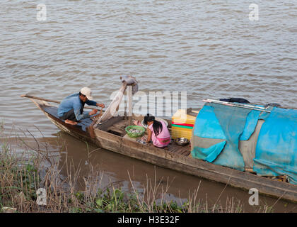 Family fishing on the Tonle Sap river in Phnom Penh,Cambodia. Stock Photo