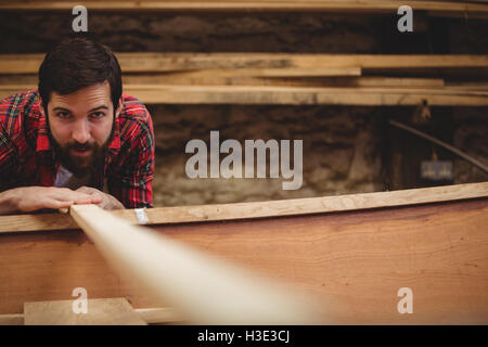 Man preparing wooden boat frame Stock Photo