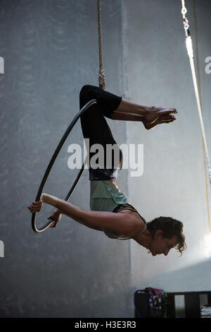 Gymnast performing gymnastics on hoop Stock Photo