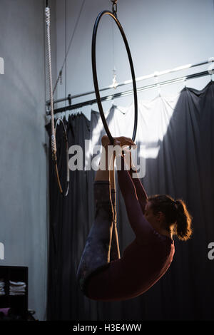 Gymnast performing gymnastics on hoop Stock Photo