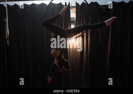 Gymnast performing gymnastics on hoop Stock Photo