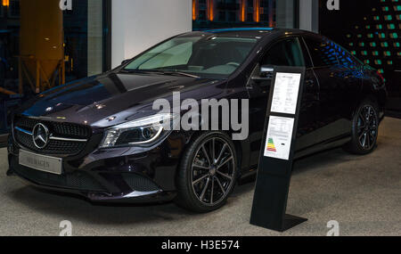 BERLIN - NOVEMBER 03, 2013: Showroom. Compact executive car Mercedes-Benz CLA 180 Coupe. Produced since 2013. Stock Photo